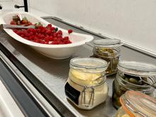 What a strange way to lay out the berries next to mayo and pickles.