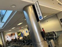 Signs upon coming up the escalator to Term E.