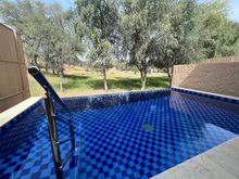 View of the pool walking out of the villa.  Looks can be deceiving as you think it's private.