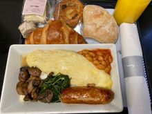 Night stop breakfast: cheese omelette, sausage, mushrooms, spinach, beans
