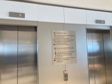 Directly left is the elevators to the lounge's upper level 