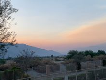 Looking west at sunset to San Jacinto and the smoke coming over the pass