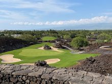 Looking back down at the Par 3 17th at Mauna Lani North, which plays down into a lava rock valley