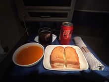 The grilled cheese and soup were hot and a good comfort food for the middle of a long flight 