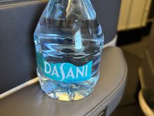 In seat water on my Polaris flight today, the water bottle they leave in the little seat cubby.  13 hour flight, 8oz of water.  Hope this helps them hit their profit targets for the quarter! 
