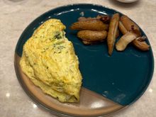 Omelette. It originally came out with mushrooms (not part of the order) so it was thankfully re-made. 
