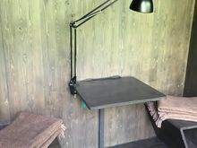 Desk built into wall with closets on either side