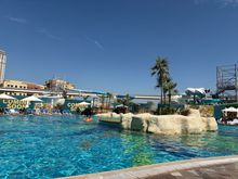 Pool with water park construction in the background