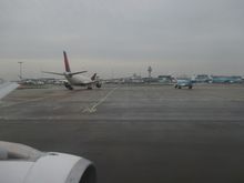 both waiting for a gate/deboarding position.