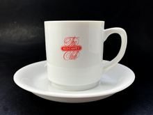 This cup and saucer set was just beginning be phased out of the RCC when I bought my first membership in 1999. The script + times roman-esque serif fonts combination was used to convey elegance and sophistication through the 1980s and 1990s, but it was starting to look dated and tired by the time of the dotcom bubble.