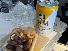 The nuts weren't warmed, at least by the time they got to me.  FA gave me a double G&T.