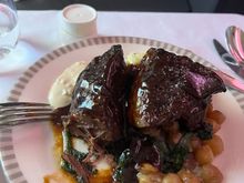 LHR to SIN 

BTC: Braised Beef short ribs. 

I was really looking forwards to this dish. Surprisingly  when I cut into it it was dry. Usually braised meat is moist when you cut into it. Thank goodness it was slathered in gravy. The gravy needed more "seasoning" and once I sprinkled more salt it tasted fine.

The portion was huge and that was satisfying.

I would not order this again as it was somewhat tasteless. 6.5/10 would be a 6 but as I had stated, it was a large portion. 