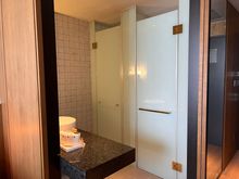 Open bathroom with sliding wood panels