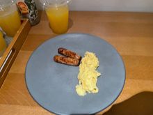 My 4 year olds scrambled eggs and chicken sausage. Might look sad but this is exactly how she ordered it — plain, nothing else touching it, and she said they were delicious 