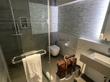 Shower Number 2: At AA arrival lounge at Terminal 3...Super small, felt like a Japanese hotel room, and had to maneuver abit to get clothes out. Good part, there was a luggage rack that had to placed in different spots based if I was using the sink or shower. Modern design!