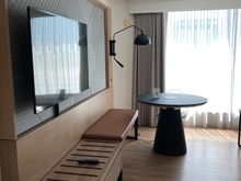 Dining table/desk with outlets elevates electrically