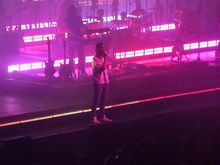 Kevin walking around the lip of the stage