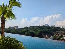 Infinity pool with views of Bukit Cina and the city