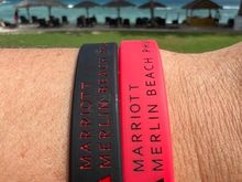 One wristband for all-inclusive, the other for Platinum + guests