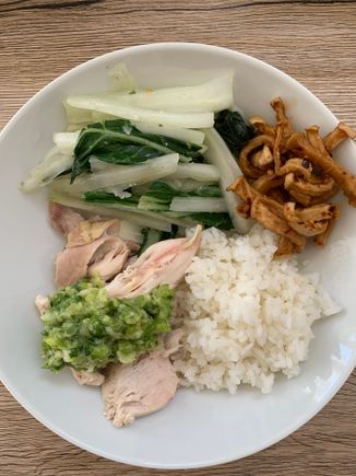 White cut chicken with scallion ginger sauce. And plenty of veggies, including homemade pickled radish. 