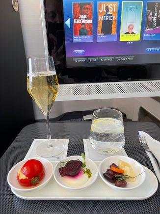 Excellent on-board service and enjoyable food and wine.  Choose the burrata appraiser, lamb shank main and Eton mess dessert. For the light meal had prosciutto, the burger (from the lunch menu) and mango desert.  All washed down with LPGS and a most decent Stint-Emilion Grand Cru. 

Despite the current limited selection in First was most satisfied with the food and wine on board.