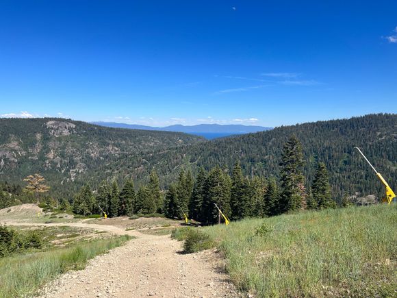 View from the top of the Resort Chair service road - 1250’ up and Lake Tahoe is visible in the distance