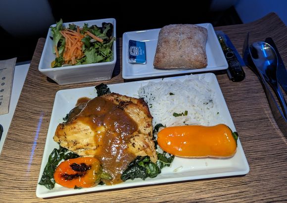Jerk chicken over kale with rice