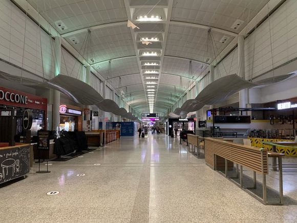 Arriving at Toronto Pearson Airport we find the terminal with few people and all shops and food outlets closed.