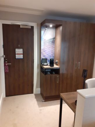 Entrance to 527 with cupboard ( safe inside) and Nespresso machine