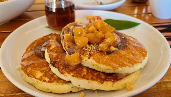 Pancakes were delicious.  Cinnamon infused, nice chars on the bottom of each pancake.  Mac sauce drizzled on the top with fresh pineapples.  Coconut and regular syrup.  Delish!