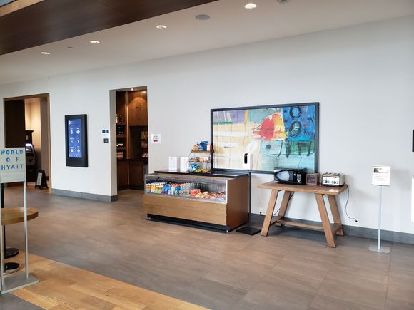 Right of the check in desk