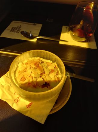 After meal, one of the FAs asked me whether I wanted fruit plate, cheese or ice cream. Toppings were mentioned, asked for almonds and was told no. A few minutes later another FA came through with the cart... Weird. And they had flaked almonds.