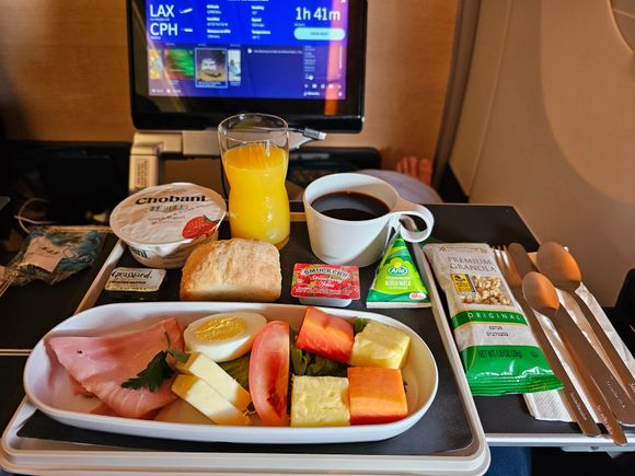 
Flew back on SK932 LAX-CPH on 6th May in the same cabin, food was good. Enjoyed the starter of coleslaw with apple followed by chunky beef and pasta. No alcohol for me as I needed sleep and managed a good near 5hrs solid sleep after dinner. Brekkie was more than adequate. Was connecting onto LHR and they announced that due to catering supply issues you could order anything from inflight menu for SAS Plus customers. My seatmates ordered the smash burger and several bottles of wine and beer. 