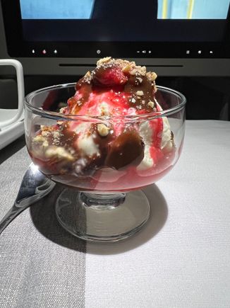 Traditional ice cream sundae - hot fudge, seasonal berry topping (raspberry), and chopped pecans.  Yummy