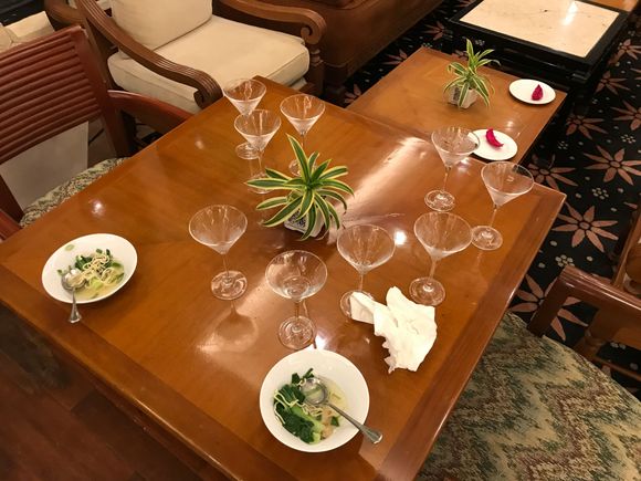Half eaten stuff and a spilled martini wasteland