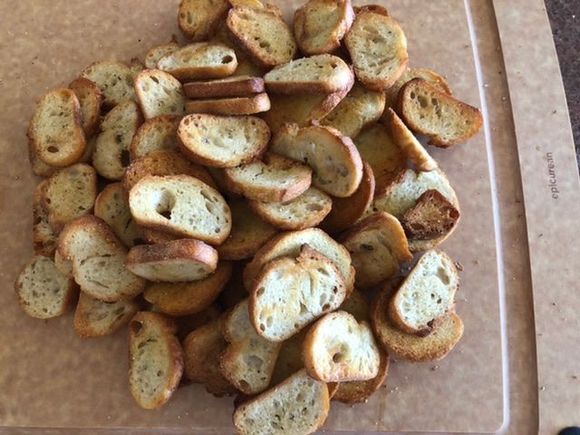 Home made garlic crostini. Will have later with Cracked Pepper Boursin cheese and fig ham. 