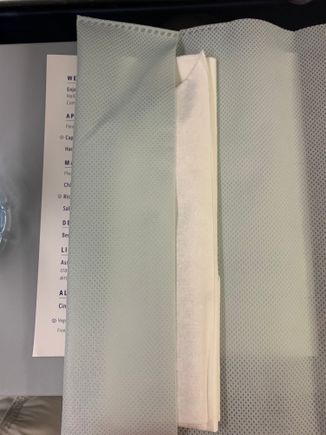 Placemat with pocket containing napkin and utensils. 