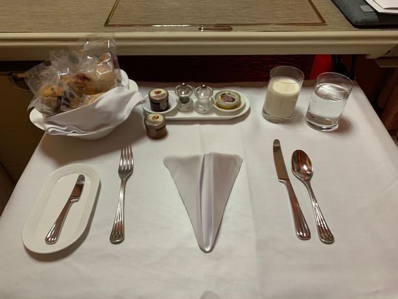 Breakfast set: pastries, smoothie and assorted jams. 