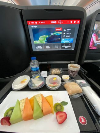 This was the fruit plate. Hot pancakes followed. You could also have had an omelette, but I have a rule of never eating egg dishes on flights :) This was our third breakfast of the day, at midday. But the food was good so I won’t complain more than that.