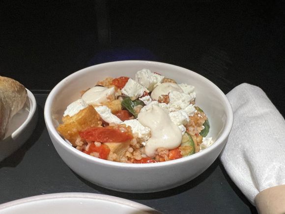 Bulgar salad - tomato, cucumber, tahini-yogurt vinaigrette.  The yogurt vinaigrette was too thick for me, but good taste on the bulgar with tomatoes and cucumbers.

