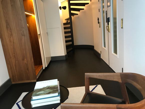 Facing spiral staircase going to upper level 