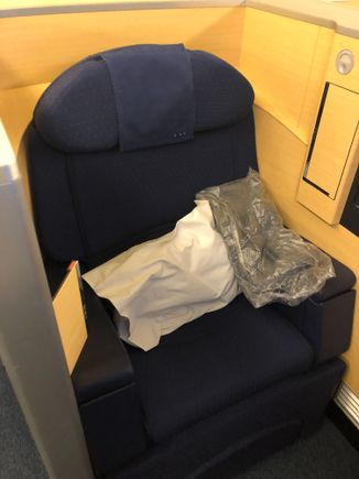 Seat with pillow and pajamas. 