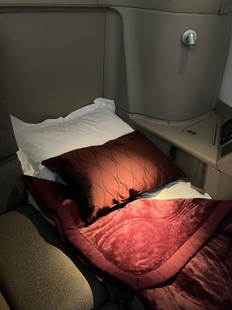 Suite 2A in bed mode with business class bedding