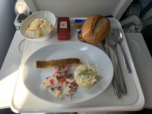 
Santorini to Munich in business today, fish, potato salad and nice sides, dessert was also good and a little box of chocolates plus the usual bread offering. Drinks were also good although if I have to be critical I will say:
Last week I went from ZRH to Santorini with Edelweiss in business, they had a real champagne while LH only carried a Prosecco. On edelweiss we got a beverage and snack before the meal came which was nice...LH took 10+ mins after serving the meal to pour drinks, no snack