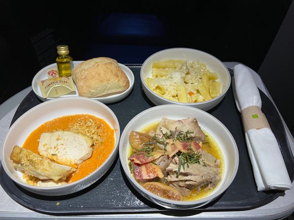 Warmed bread, cacio e pepe; pork shoulder, and chicken