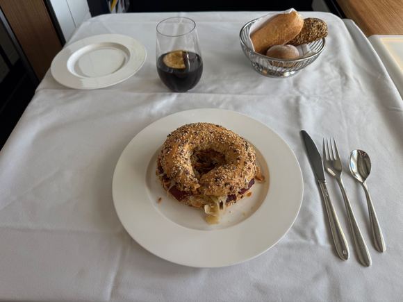 Beef pastrami bagel with mustard, sauerkraut and fried onions