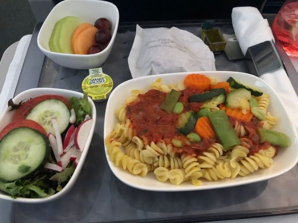 This seems to be the new standard veggie meal for F mid-length.  It's still a vegan meal even if you order dairy vegetarian. It's fine and that is all it is. There is no flavor to speak of, but it's not offensive. At the very least they could put some parmesan on the side for those who want it. 