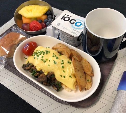 enroute to canada from hawaii , a hot breakfast is served before landing