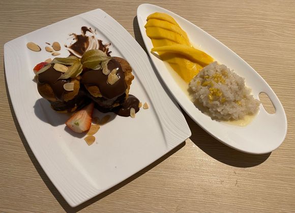 Chocolate profiteroles with chocolate ice cream and mango sticky rice