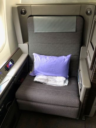 Let's start with the seat itself. I think it would be wide enough for just about anyone to fit, and I could only comfortably put one arm on an armrest at a time. The seat was fairly hard and the fabric wasn't particularly soft, but that was fine by me since I was wearing comfortable clothes.